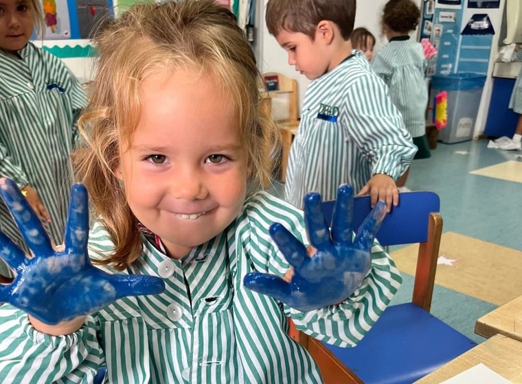 nursery, girl doing arts and crafts